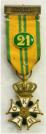 Kruis voor Betoonde Marsvaardigheid (Vierdaagsekruis). Ge�mailleerde versie met cijfer 21 voor 21e deelname. Maker: W. v. Veluw BV Zeist. Prijs: �.85,-